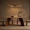 Zoya bronze pendant light illuminating a modern dining room