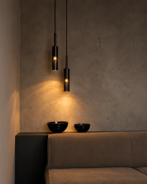 Abramo Pendant Lights Modern Interior Two Abramo cylindrical pendant lights suspended at different heights above a contemporary seating area