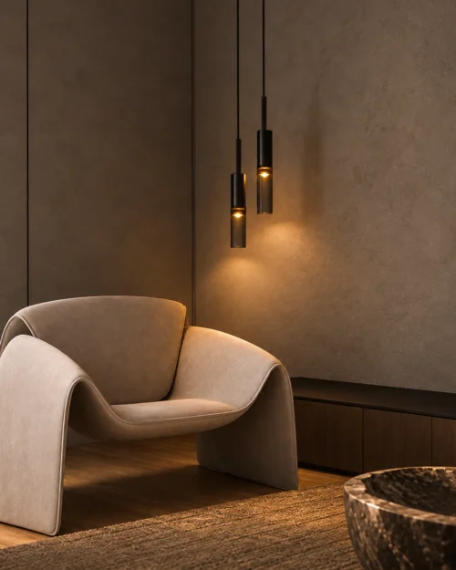 Abramo Smoky Glass Pendant Lights Living Room Abramo smoky glass pendant lights arranged at varying heights beside a modern lounge chair