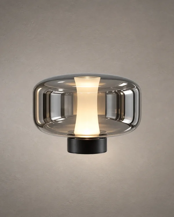 Adina Smokey Grey table lamp with rounded glass body and illuminated center