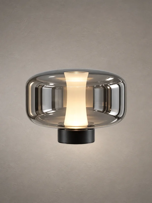 Adina Smokey Grey table lamp with rounded glass body and illuminated center