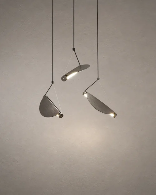 Aion pendant light featuring three angled cylindrical shades in Rustic Coffee and White