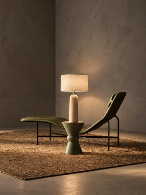 Albora table lamp beside a modern lounge chair in a warm contemporary interior