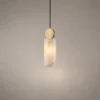 Alexandra Marble Pendant Light Copper Alexandra modern pendant light featuring a cylindrical marble shade and copper-finished circular accent