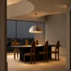 Amana grey dome-shaped pendant light illuminating a contemporary dining area