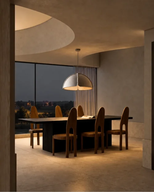 Amana grey dome-shaped pendant light illuminating a contemporary dining area