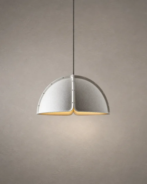 Amana modern split-dome pendant light featuring a textured grey shade and illuminated interior