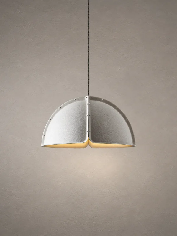 Amana Modern Dome Pendant Light Amana modern split-dome pendant light featuring a textured grey shade and illuminated interior