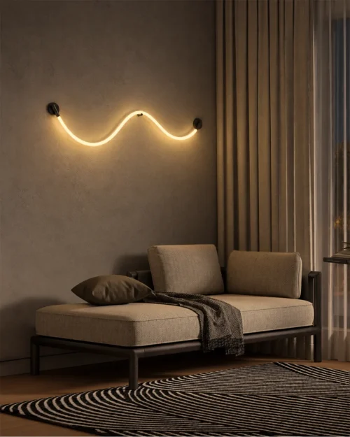 Archer sculptural wave wall lamp providing soft ambient illumination above a modern lounge sofa