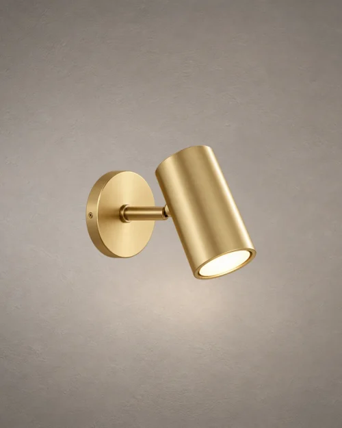 Aurelio Gold LED Wall Spotlight Aurelio modern cylindrical LED wall spotlight with an electroplated gold finish and circular mounting base