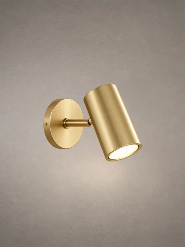 Aurelio Gold LED Wall Spotlight Aurelio modern cylindrical LED wall spotlight with an electroplated gold finish and circular mounting base