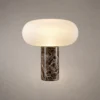Auren Modern Sculptural Table Lamp Auren table lamp with rounded ribbed white shade and dark marble-style cylindrical base