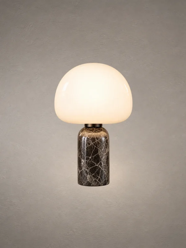 Avorio Modern Sculptural Table Lamp Avorio table lamp with a rounded white dome shade and dark marble-patterned cylindrical base