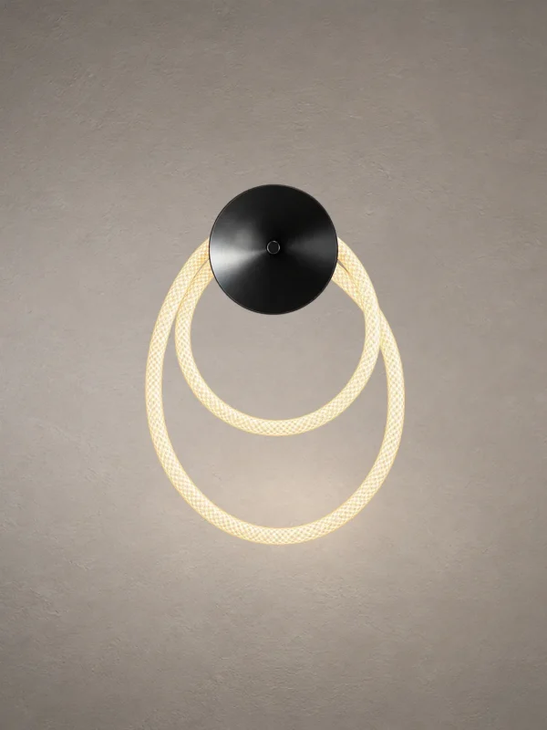 Ayla modern gun black wall lamp featuring two overlapping illuminated circular rings