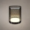 Bellora cylindrical table lamp with vertical metal grille detailing and illuminated base