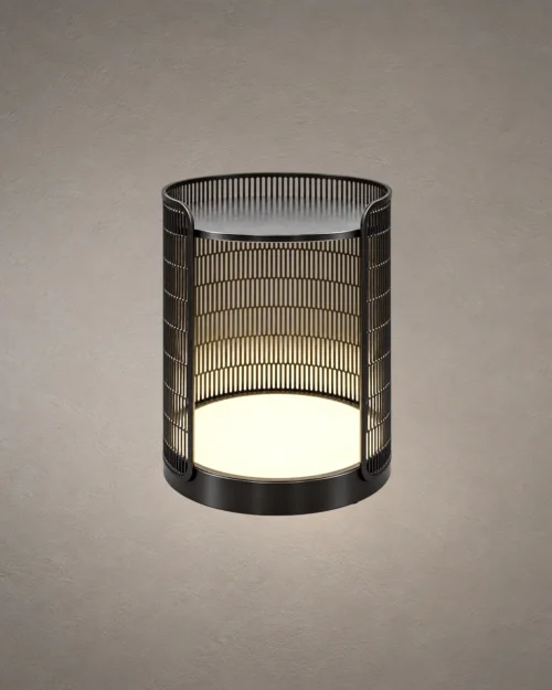 Bellora cylindrical table lamp with vertical metal grille detailing and illuminated base
