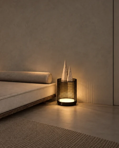 Bellora decorative table lamp beside a contemporary sofa in a warm minimalist living room