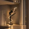 Civil Gymnast sculptural floor lamp with glowing ribbon displayed in a contemporary interior