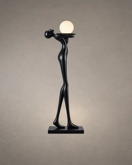 Civil Love black sculptural floor lamp featuring an elongated human figure holding a glowing spherical light