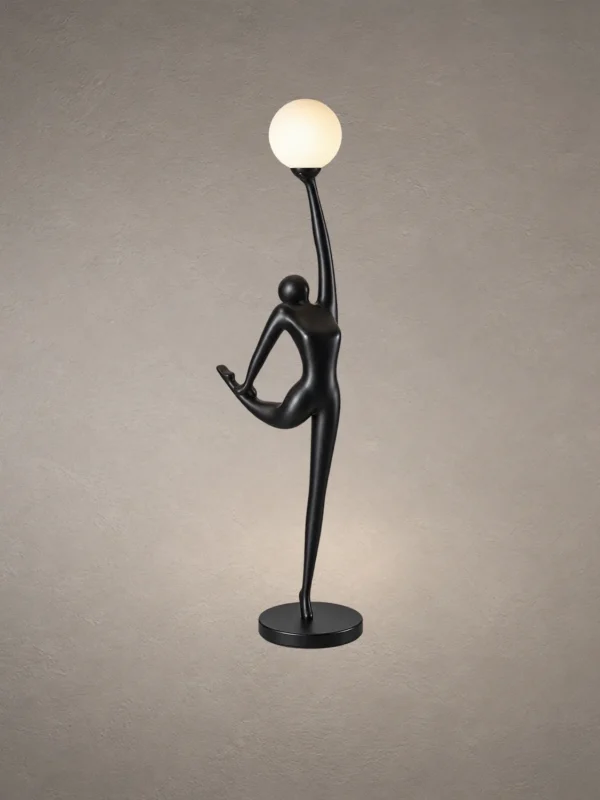 Civil Reaching black sculptural floor lamp featuring a human-inspired figure holding an illuminated white globe