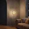 Clymene Floor Lamp with ribbed glass shade in a contemporary living room
