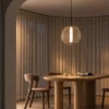 Clymene Pendant Light above a dining table in a contemporary interior