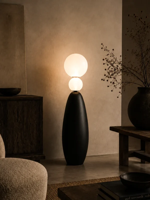 Deimos sculptural floor lamp with dual illuminated globes in a warm modern living room