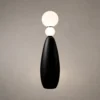 Deimos Modern Sculptural Floor Lamp Deimos floor lamp featuring two illuminated white spherical shades and a tapered black base