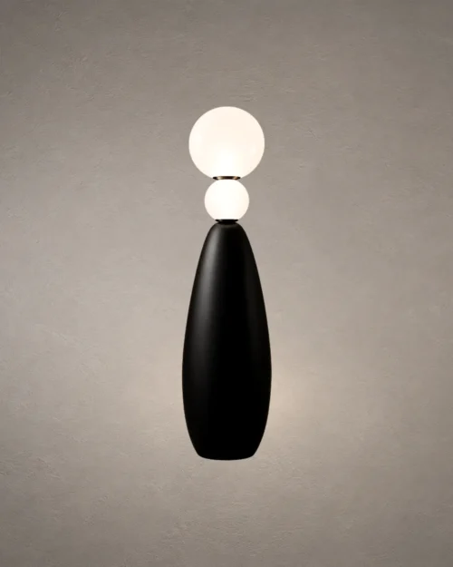 Deimos Modern Sculptural Floor Lamp Deimos floor lamp featuring two illuminated white spherical shades and a tapered black base