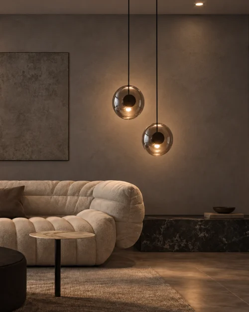 Dione Pendant Light Contemporary Interior Dione pendant lights with rounded glass forms above a modern living room seating area