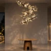 Doncella Chandelier Modern Interior Doncella sculptural floral chandelier suspended above a round table in a modern interior