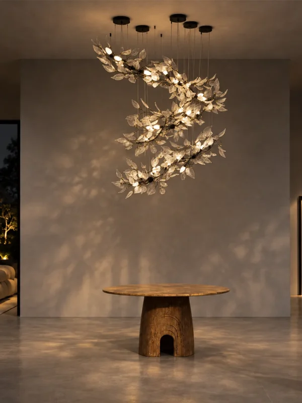 Doncella sculptural floral chandelier suspended above a round table in a modern interior