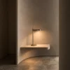 Elian Table Lamp Modern Interior Elian minimalist table lamp illuminating a floating shelf in a contemporary interior