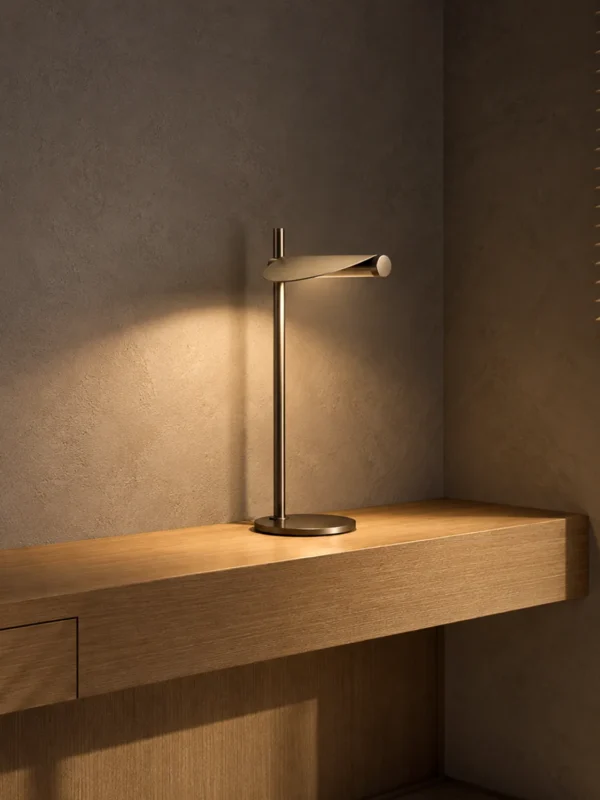 Elian table lamp with Rustic Coffee finish on a wooden console against a textured wall