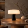 Elvera Table Lamp Contemporary Dining Room Elvéra table lamp with a black cylindrical base on a round wooden dining table