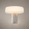 Elvera White Sculptural Table Lamp Elvéra table lamp featuring a rounded white shade and marble-inspired cylindrical base