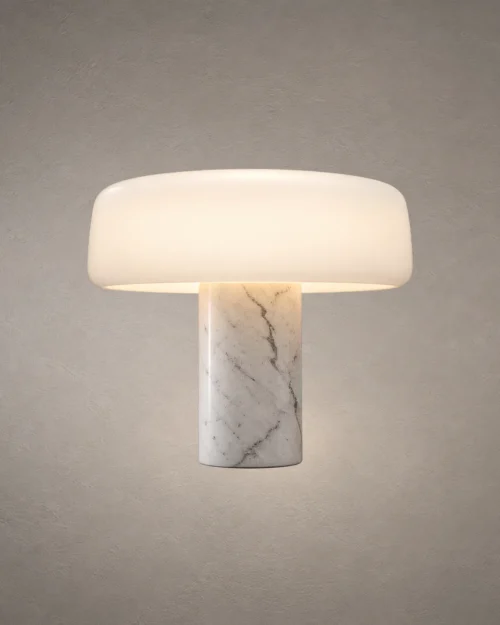 Elvera White Sculptural Table Lamp Elvéra table lamp featuring a rounded white shade and marble-inspired cylindrical base