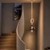 Evadne Pendant Light Staircase Interior Evadne sculptural pendant light suspended beside a modern staircase
