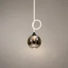 Evadne Sculptural Pendant Light Evadne pendant light with Smokey glass sphere and illuminated circular accent