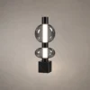 Forma Modern Sculptural Table Lamp Forma table lamp featuring two stacked smoky glass spheres and a geometric black base