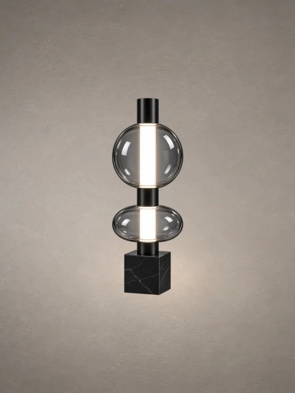 Forma table lamp featuring two stacked smoky glass spheres and a geometric black base