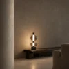 Forma Table Lamp Contemporary Living Room Forma sculptural table lamp displayed on a low wooden console in a modern living room