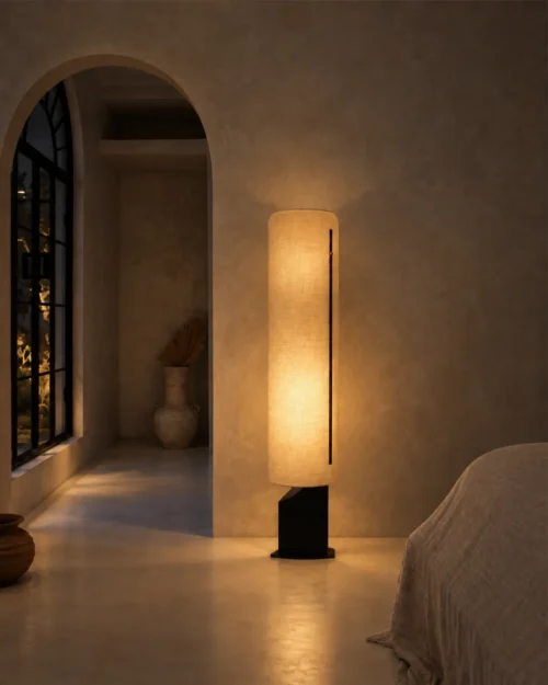 Geremie Floor Lamp Modern Interior Geremie tall cylindrical floor lamp illuminating a warm minimalist interior with an arched doorway