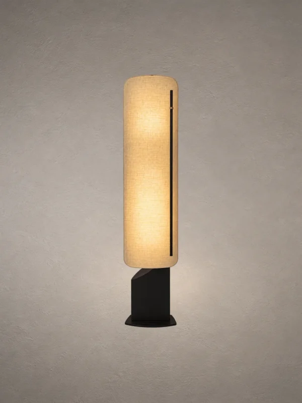 Geremie modern floor lamp with an elongated textured beige shade and sculptural black base