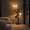 Humano Aria Black Floor Lamp Contemporary Interior Humano Aria black fiberglass floor lamp with four illuminated globes in a contemporary living room