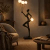 Humano Aria Floor Lamp Modern Living Room Humano Aria floor lamp featuring a graceful black figure holding glowing spherical lights beside a modern sofa