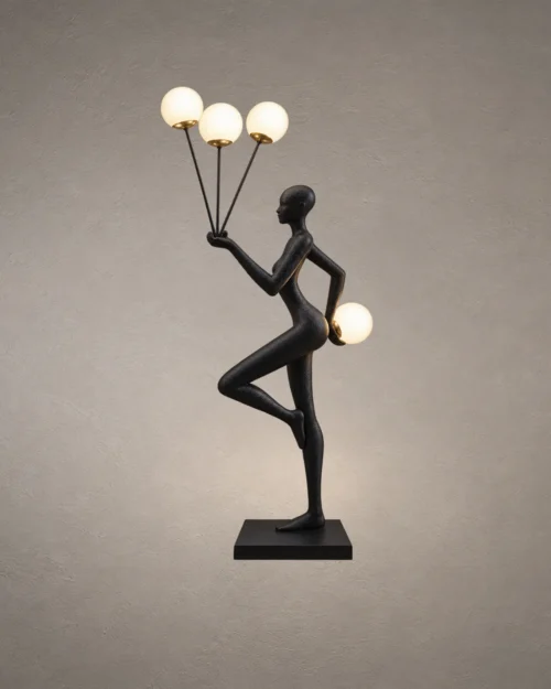 Humano Aria Sculptural Floor Lamp Humano Aria black sculptural floor lamp with a balancing human figure and four illuminated white globes