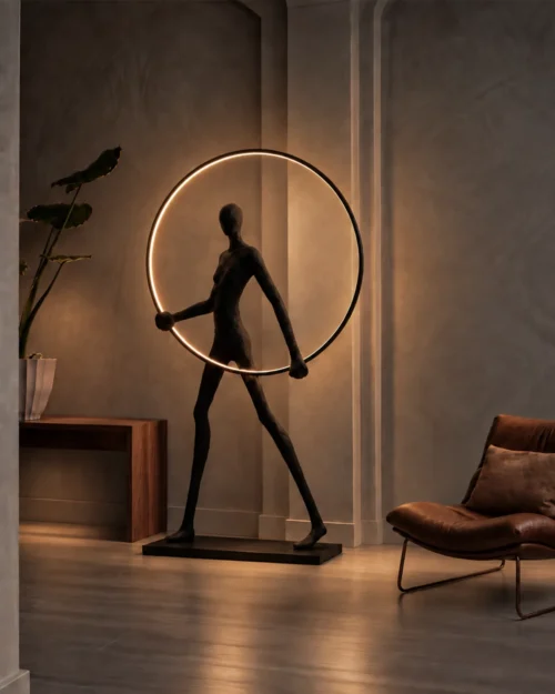 Humano Round floor lamp with a glowing circular ring displayed beside a lounge chair in a contemporary living room