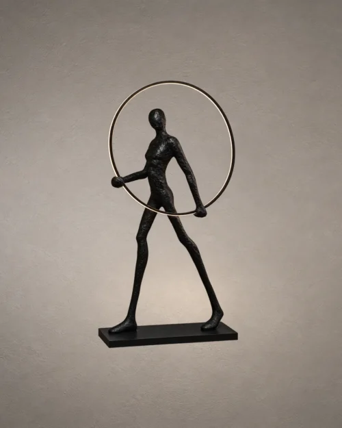 Humano Round black sculptural floor lamp featuring a human figure holding an illuminated circular ring