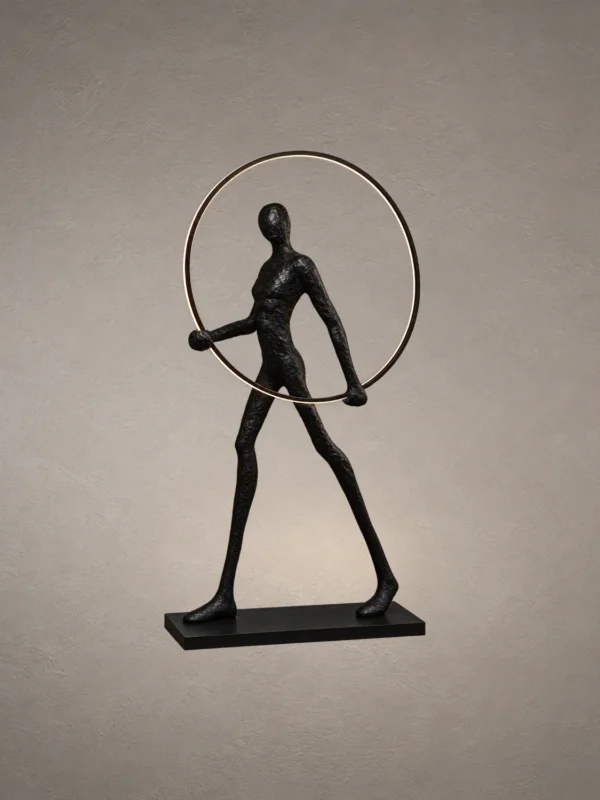 Humano Round black sculptural floor lamp featuring a human figure holding an illuminated circular ring